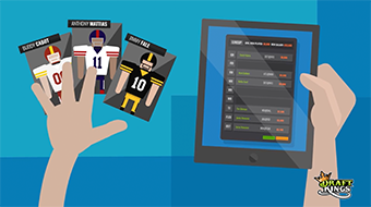 Top down view of two hands; the left is holding trading cards, the right is holding a tablet